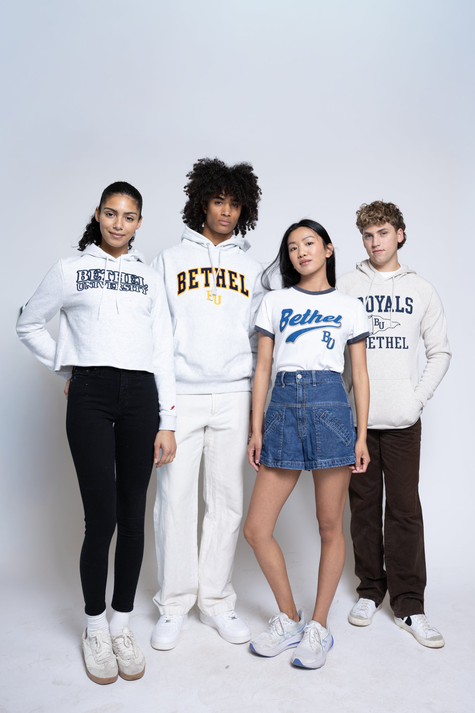 Four people wearing Bethel branded clothing on a white background